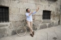 Young happy man taking selfie with mobile phone on retro cool vintage bike Royalty Free Stock Photo