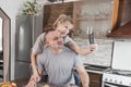 a young happy married couple smeared with flour takes a selfie in the kitchen Royalty Free Stock Photo