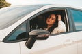 Young happy millennial brunette woman driving car. Young attractive woman in the car. Woman drive an auto. Close up Royalty Free Stock Photo