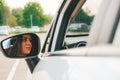 Young happy millennial brunette woman driving car. Young attractive woman in the car. Woman drive an auto. Close up Royalty Free Stock Photo