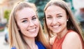 Young happy millennial girls having fun together - University students taking closeup selfie on the streets - Youth and friendship Royalty Free Stock Photo