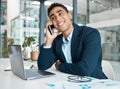 Young happy mixed race businessman talking and thinking on a call using a phone and working on a laptop alone at work