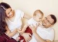 Young happy modern family smiling together at home. lifestyle people concept, father holding baby son Royalty Free Stock Photo