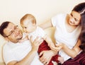 Young happy modern family smiling together at home. lifestyle people concept, father holding baby son Royalty Free Stock Photo