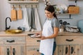 Young happy mom and her baby cook cookies at home in the kitchen. Christmas Homemade Gingerbread. cute boy with mother in white Royalty Free Stock Photo