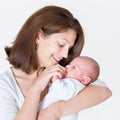 Young happy mother holding her newborn baby Royalty Free Stock Photo