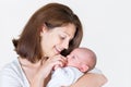 Young happy mother holding her newborn baby Royalty Free Stock Photo