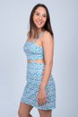 Young happy multi-ethnic woman smiling and thinking while wearing sundress Royalty Free Stock Photo