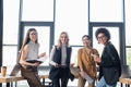 young and happy multiethnic businesswomen smiling