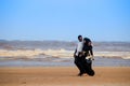 A young happy Muslim black couple are walking along the coast of the Indian Ocean