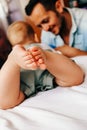 Young happy parenting. Careful young father playing with his little cute baby boy. Royalty Free Stock Photo