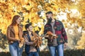 Happy parents having fun with their boy while running in the park during autumn day Royalty Free Stock Photo