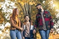 Happy parents having fun with their boy while running in the park during autumn day Royalty Free Stock Photo