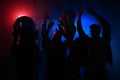 Young happy people are dancing in club. Nightlife and disco concept. Royalty Free Stock Photo