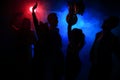 Young happy people are dancing in club. Nightlife and disco concept. Royalty Free Stock Photo
