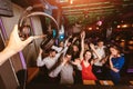 Happy people are dancing in club. Nightlife and disco concept Royalty Free Stock Photo