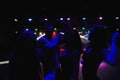 Young happy people are dancing in club. Nightlife and disco concept. Royalty Free Stock Photo