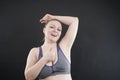 Young happy plus size caucasian woman shows her unshaved armpit Royalty Free Stock Photo