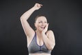 Young happy plus size caucasian woman shows her unshaved armpit Royalty Free Stock Photo