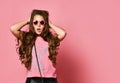 Young happy plus size girl model with long hair in stylish summer casual clothing and sunglasses feeling surprised Royalty Free Stock Photo