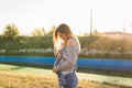 Young happy pregnant woman relaxing and enjoying life in autumn nature Royalty Free Stock Photo