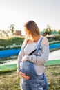 Young happy pregnant woman relaxing and enjoying life in autumn nature Royalty Free Stock Photo