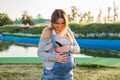 Young happy pregnant woman relaxing and enjoying life in autumn nature Royalty Free Stock Photo