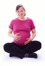 Young happy pregnant woman sitting Royalty Free Stock Photo