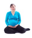 Young happy pregnant woman sitting Royalty Free Stock Photo