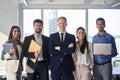 Young happy professional team business people standing in office. Portrait Royalty Free Stock Photo