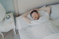 Young happy relaxed caucasian man sleeping in bed Royalty Free Stock Photo