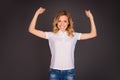 Young happy sexy woman showing her muscles Royalty Free Stock Photo