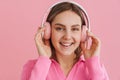 Young happy smiling attracitve girl enjoyig music