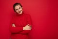 Young happy smiling attractive brunette woman with sincere emotions isolated on background wall with copy space wearing Royalty Free Stock Photo