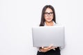 Young happy smiling business woman in casual clothes holding laptop and sending email isolated on white background Royalty Free Stock Photo