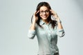 Young happy smiling businesswoman wearing glasses standing Royalty Free Stock Photo