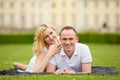 Young, happy and smiling couple lies on a grass Royalty Free Stock Photo