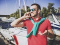 Young Happy Smiling Man in Glasses in Yacht Club. Royalty Free Stock Photo