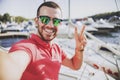 Young Happy Smiling Man in Glasses in Yacht Club. Royalty Free Stock Photo