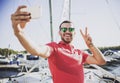 Young Happy Smiling Man in Glasses in Yacht Club. Royalty Free Stock Photo