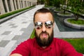 Young happy smiling man traveler make selfie on the city10