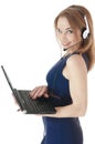 Young happy smiling support phone female operator wearing a headset. Royalty Free Stock Photo