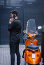 Young happy smiling urban professional man using smart phone Royalty Free Stock Photo