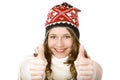 Young happy smiling woman with cap shows thumbs up Royalty Free Stock Photo