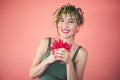 Young happy smiling woman with cool hairstyle asparagus on head and red hot chili peppers in her hands Royalty Free Stock Photo