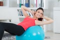 Young happy smiling woman doing fitness exercise with fit ball Royalty Free Stock Photo