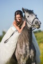 Young happy smiling woman with horse