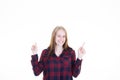 Young happy smiling woman points two hands fingers left right to empty white copy space blank background Royalty Free Stock Photo