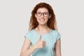 Young happy smiling woman showing thumbs up gesture. Royalty Free Stock Photo