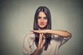 Young, happy, smiling woman showing time out gesture Royalty Free Stock Photo